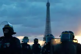 France imposes partial curfews after violent protests