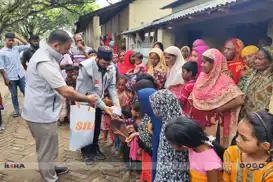International aid organizations distribute sacrificial meat to needy families in Bangladesh