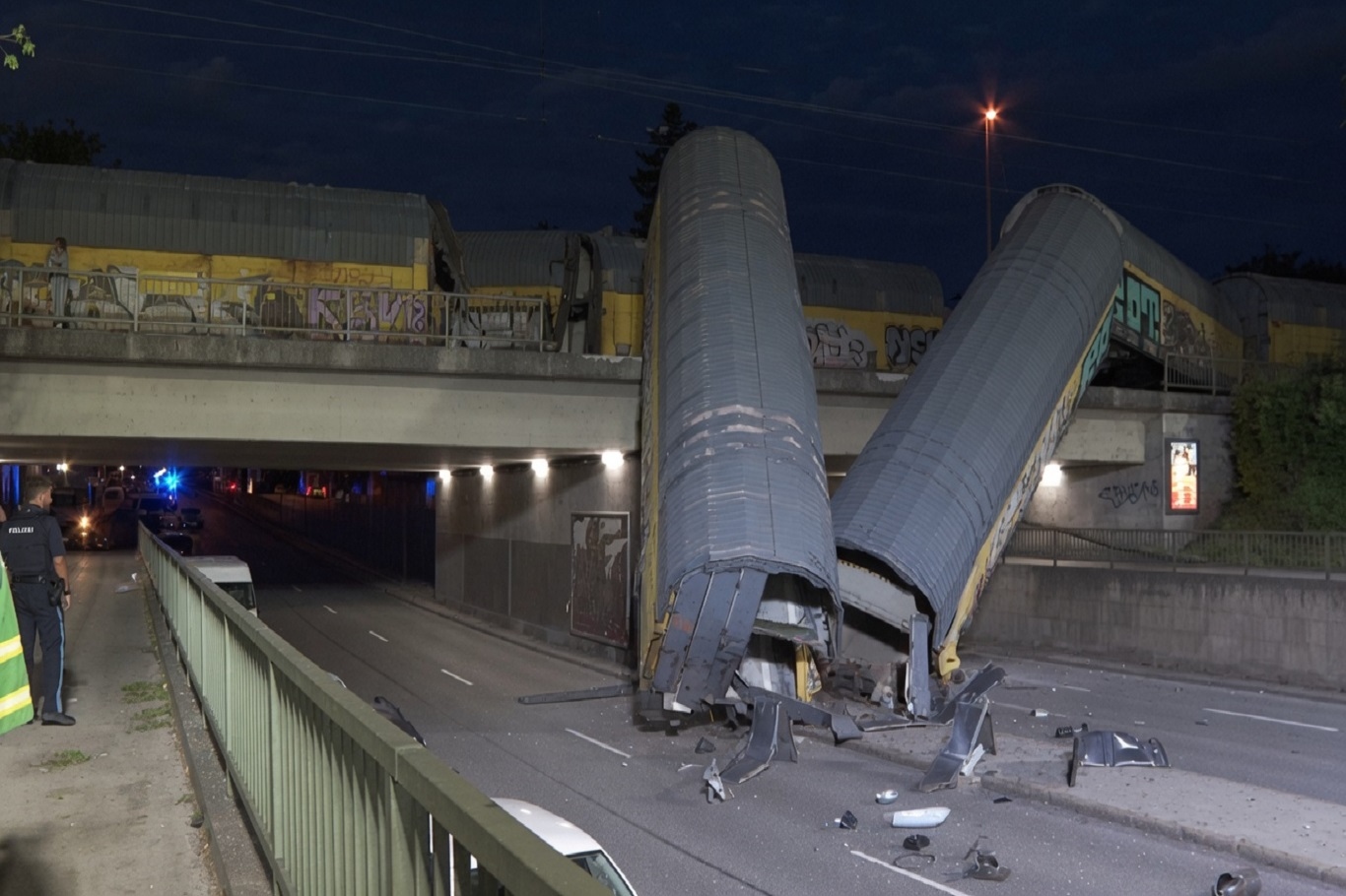 One dead after freight cars plunge from bridge in Germany