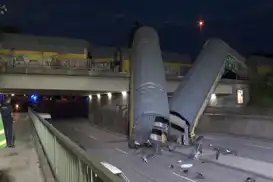 One dead after freight cars plunge from bridge in Germany